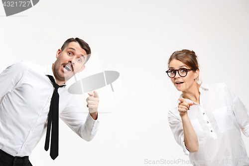 Image of Successful business couple at the office looking at camera