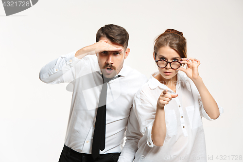 Image of Successful business couple at the office looking at camera