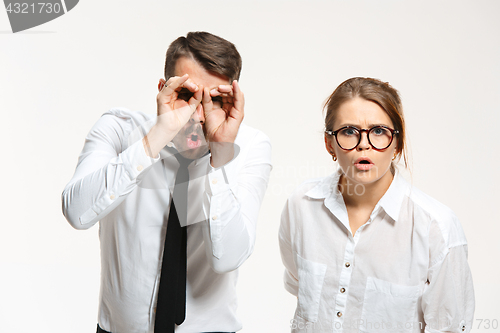 Image of Successful business couple at the office looking at camera