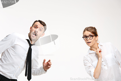 Image of Successful business couple at the office looking at camera