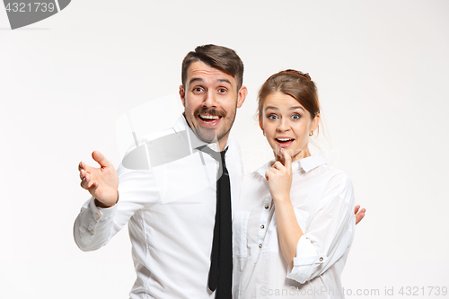 Image of Successful business couple at the office looking at camera