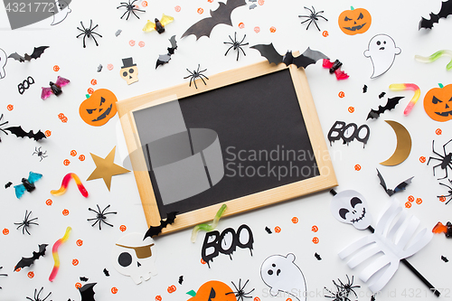 Image of blank chalkboard and halloween party decorations