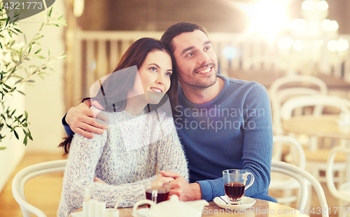 Image of happy couple drinking tea at restaurant