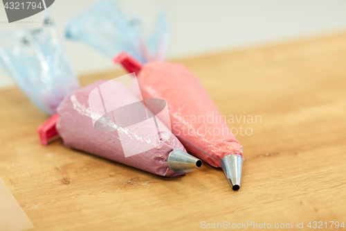Image of confectionery bags with macaron batter or cream