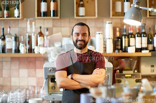 Image of happy man, barman or waiter at bar