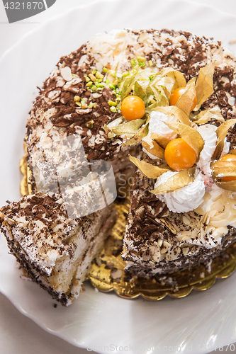 Image of cake with walnuts and physalis