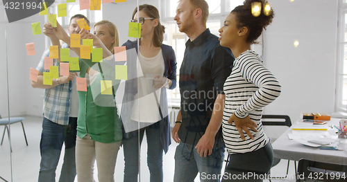 Image of Young people working together in office