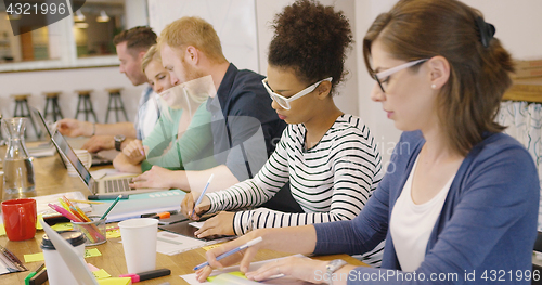 Image of People working individually in office