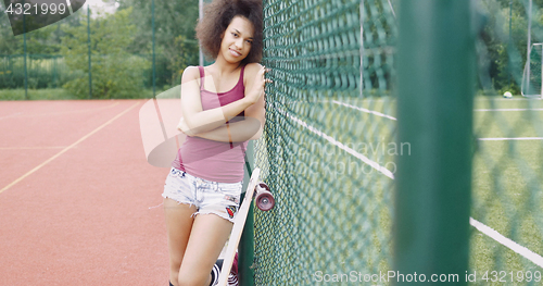 Image of Charming woman on sports ground