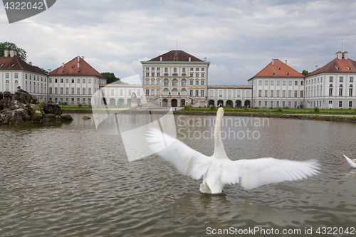 Image of Dramatic scenery of post storm sunset of Nymphenburg palace in Munich Germany.