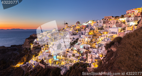 Image of Oia village at sunset, Santorini island, Greece.