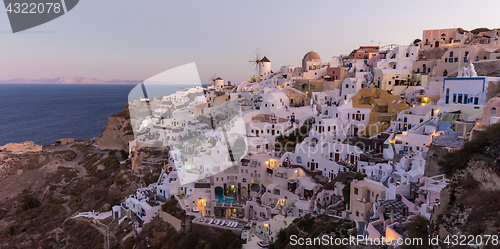 Image of Oia village at sunrise, Santorini island, Greece.