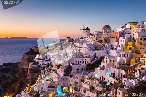 Image of Oia village at sunset, Santorini island, Greece.