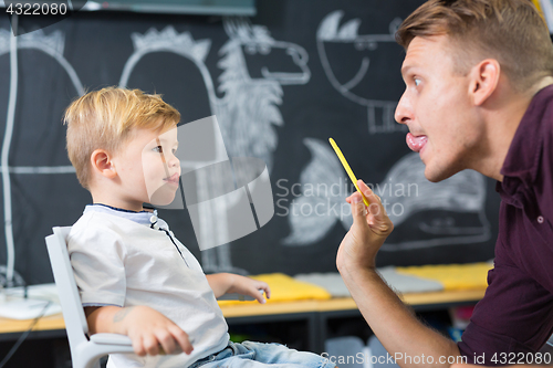 Image of Cute little boy at speechtherapist session.