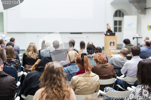 Image of Woman giving presentation on business conference.