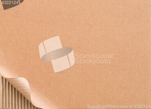 Image of Corrugated cardboard with curled corner