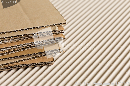 Image of Cardboard pile on corrugated background