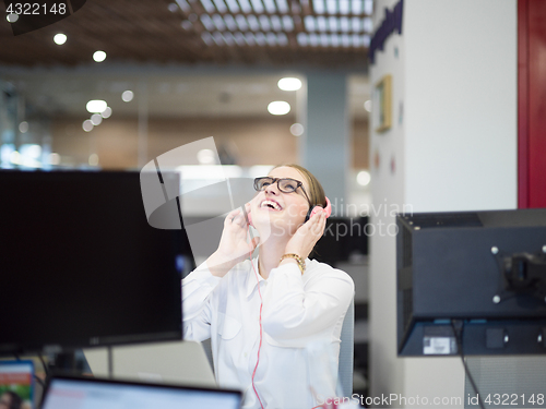 Image of businesswoman using a laptop in startup office