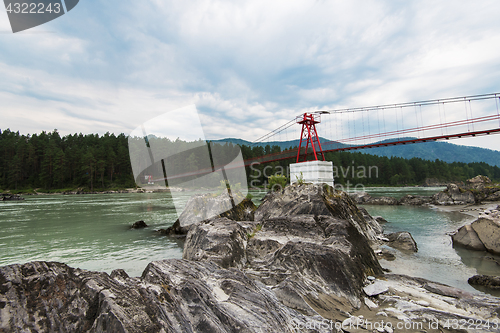 Image of suspension bridge on mountain river