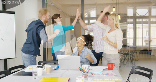 Image of Workers giving high five