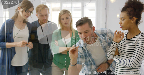 Image of Interested colleagues taking part in work process