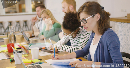 Image of Young concentrated wokers in office