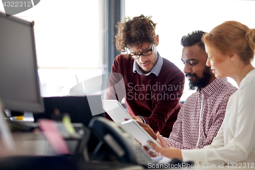 Image of business team with tablet pc computers in office