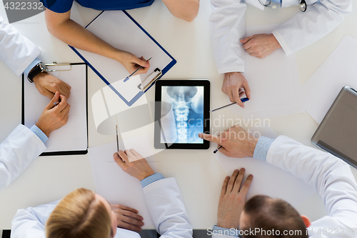 Image of doctors with spine x-ray on tablet pc computer