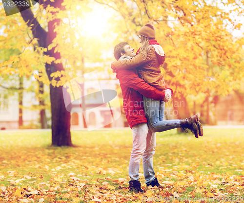 Image of happy young couple meeting in autumn park