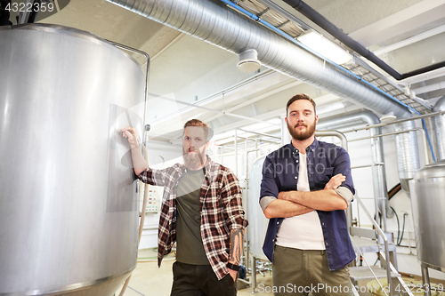 Image of men at craft brewery or beer plant