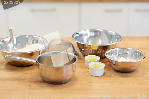Image of bowls with flour and egg whites at bakery kitchen