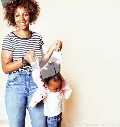 Image of adorable sweet young afro-american mother with cute little daugh