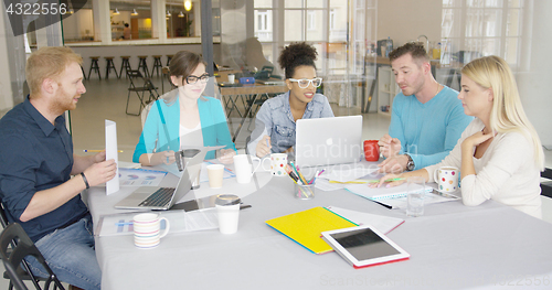 Image of Group of people collaborating in office