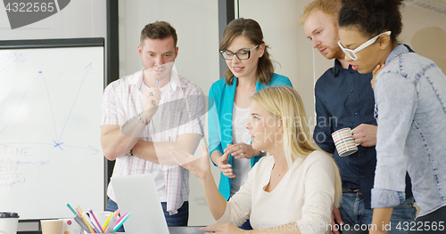 Image of Young people brainstorming in office