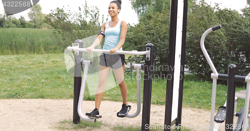 Image of Cheerful girl training at street