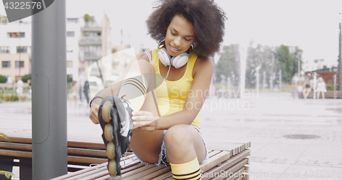 Image of Sportive woman wearing rollers