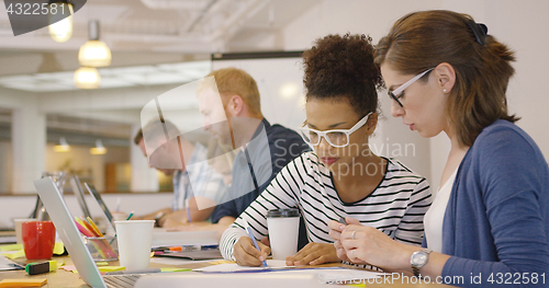 Image of Busy people in contemporary office
