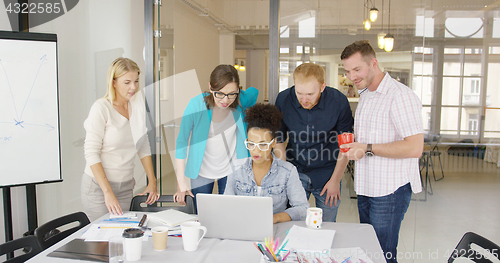 Image of Colleagues watching information at laptop