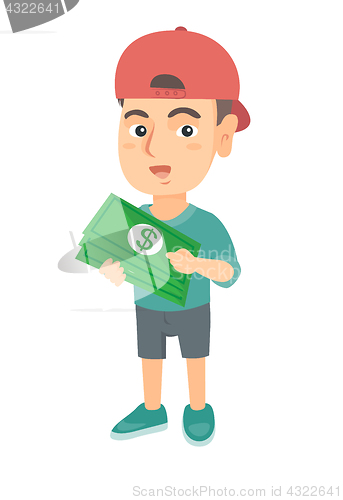 Image of Caucasian boy in a cap holding money in hands.