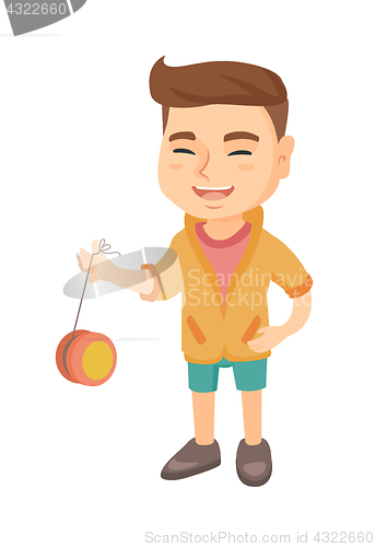 Image of Caucasian boy playing with yo-yo.