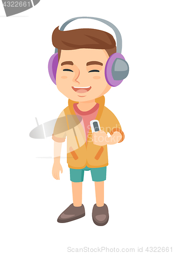 Image of Caucasian boy listening to music in headphones.