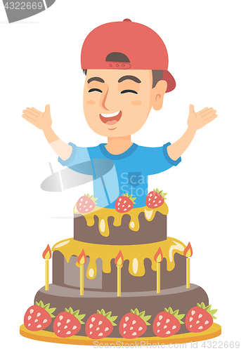 Image of Little caucasian boy jumping out of a large cake.