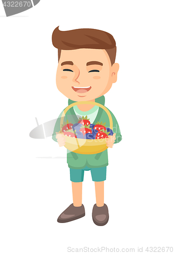 Image of Boy with the basket of strawberry and blueberry.