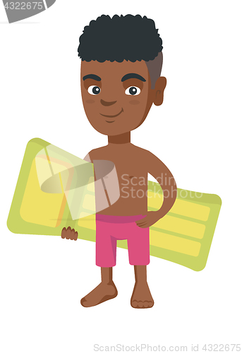 Image of Little african boy holding inflatable mattress.