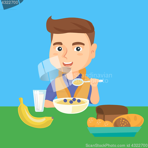 Image of Caucasian boy eating porridge for breakfast.