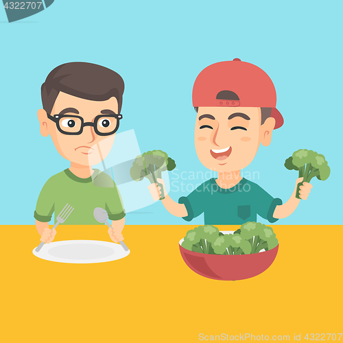 Image of Two caucasian boys eating broccoli.