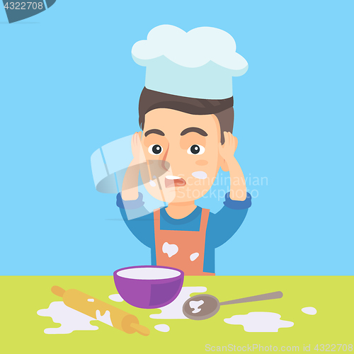 Image of Little caucasian chef making mess during cooking.