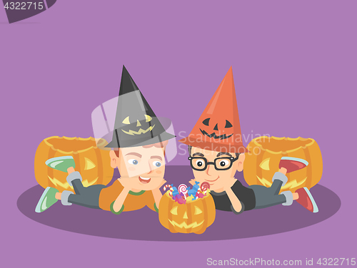 Image of Caucasian boys staring at the pumpkin with candies