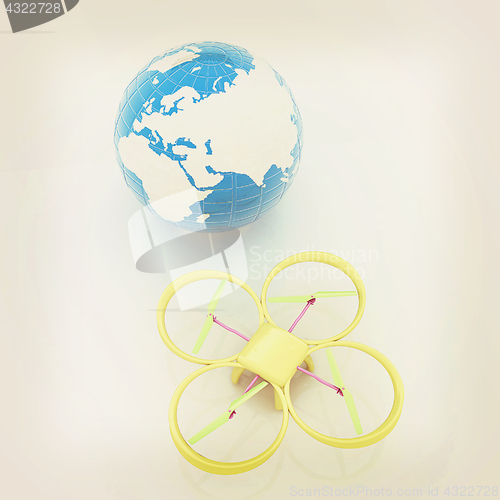 Image of Quadrocopter Drone with Earth Globe and remote controller on a w