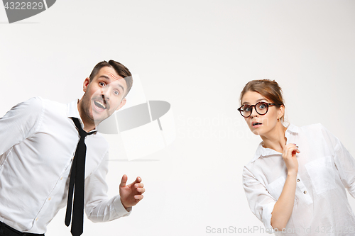 Image of Successful business couple at the office looking at camera